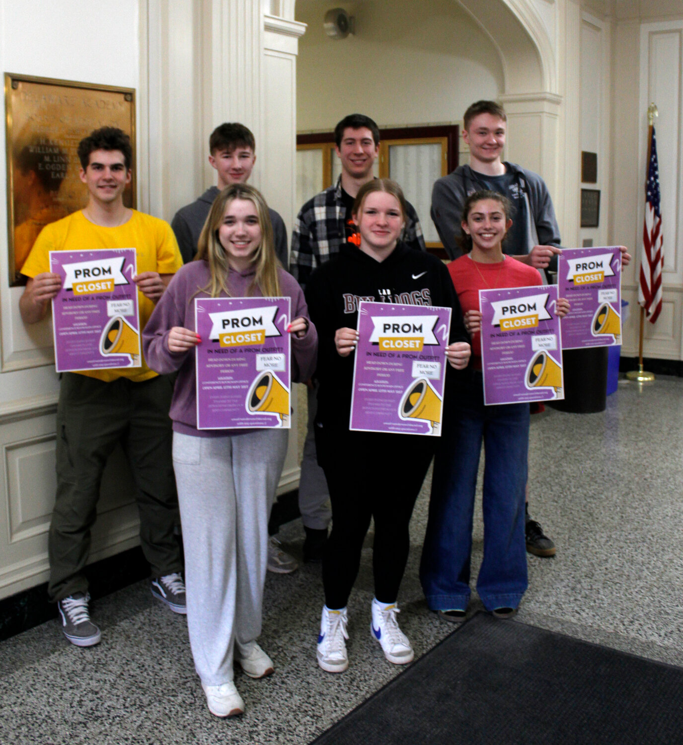 Delaware Academy juniors hold posters for their community project, the Prom Closet. Pictured are (front row) Natalie Anderson, Brinley Wager, Abby Tessier, and (back row) Isaac Marsiglio, Ivan Richardson, Rocco Schnabel and Seamus deMauro.